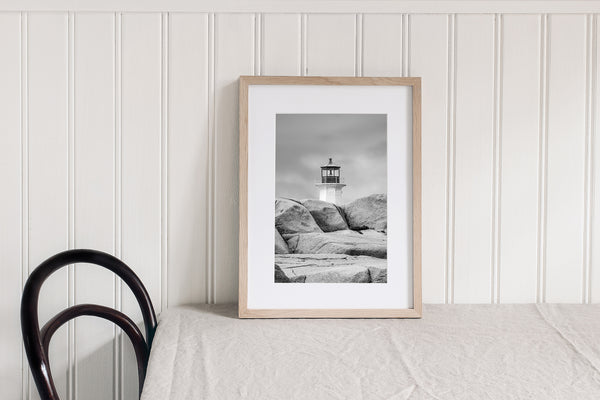 Monochrome lighthouse and rocky landscape