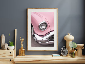 Side profile of Pink Oldsmobile classic car