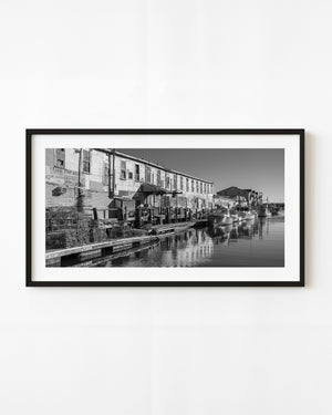 Harbor Fish Market and fishing boats along Portland’s waterfront in black and white