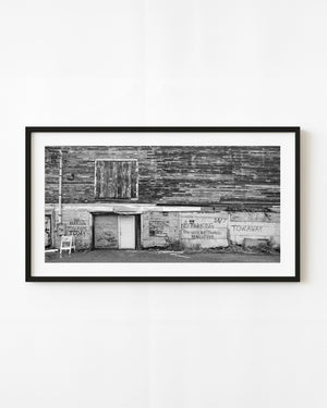 Weathered Portland Maine building covered with No Parking and Tow Away signs