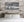 Old fish market exterior with patched walls and bold handwritten lettering