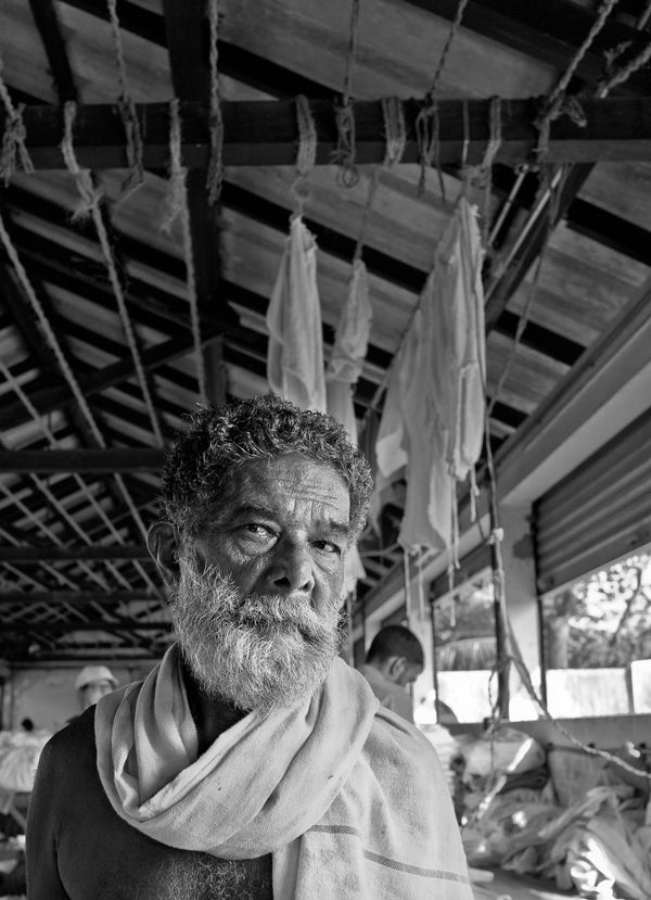 Black and white portrait of Indian laborer