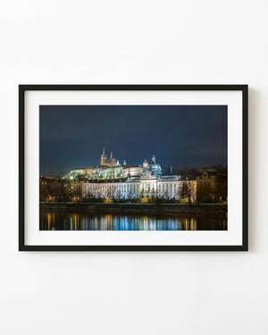 Illuminated Prague Castle above the Vltava River at night
