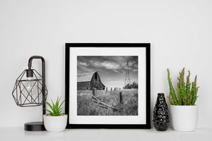 Historic farmstead and windmill black and white photo