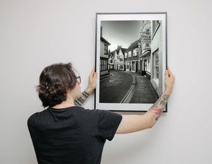 Historic fish and chips sign on street in Rye England