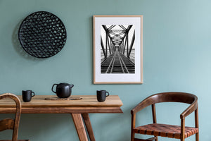 Old train bridge with wet wooden ties and metal beams