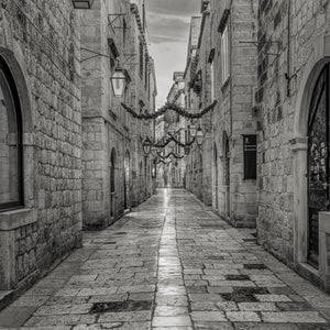 Black and white view along an empty Dubrovnik lane in January