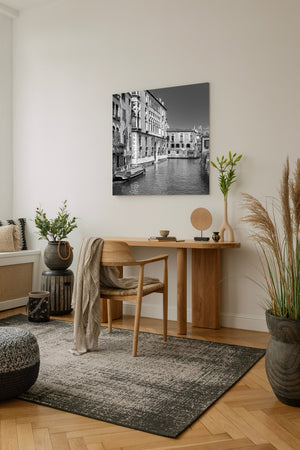 Calm canal water reflecting Venetian architecture