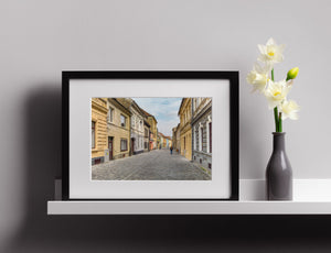 Faded stucco buildings street scene