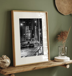 Sidewalk shadows under theater lights