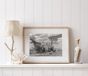 Weathered building with boarded-up windows in rural Nevada