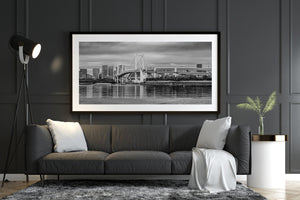Black and white photo of Tokyo Rainbow Bridge and city buildings