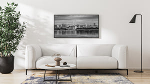 Waterfront view of Tokyo skyline and Rainbow Bridge in monochrome