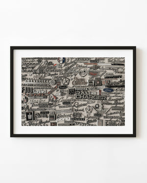 Vintage car emblems mounted on display wall