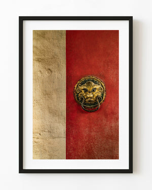 Ancient guardian door knocker on a red door in Ulanbatar