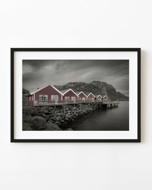 Red fishermen cabins on the waterfront in Mortsund Norway