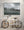 Muted coastal landscape with red cabins and dramatic winter mountains