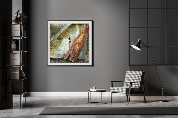 Striking image of a red rowboat and weathered wall