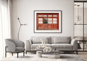 Detailed view of weathered red door at historic site