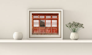 extured red door against ancient stone wall