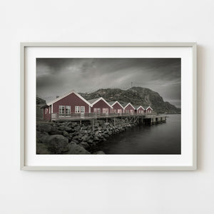 Red fishermen cabins on the waterfront in Mortsund Norway
