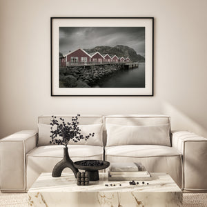 Horizontal view of Mortsund cabins under dramatic clouds