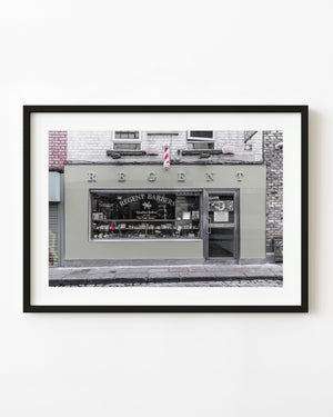 Regent Barbers storefront in Dublin with a red and white barber pole