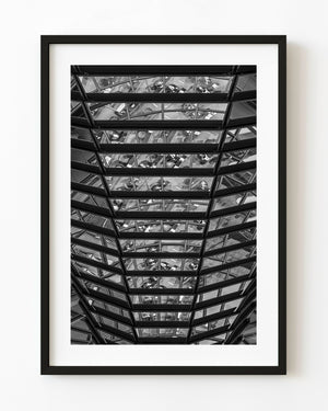 Geometric steel and glass structure inside Berlin’s Reichstag in black and white