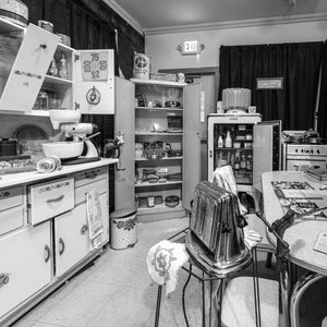 Black and white photograph of an old-fashioned kitchen along Route 66