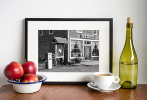 Old-fashioned store porch with benches and flower pots