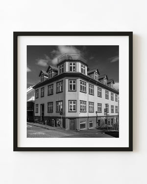 Black and white Reykjavik corner building with angular facade