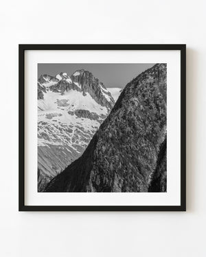 Rock and snow-covered peaks in the Canadian Rockies in black and white