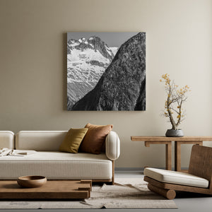 Dark rocky slope contrasting with bright snow in the Canadian Rockies