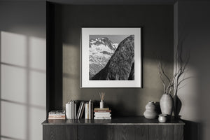 Square black and white photograph of layered mountain faces