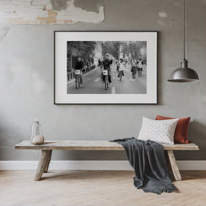 group of cyclists moving down city road Bucharest street scene