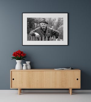 Romania rural agriculture portrait elderly man behind fence monochrome