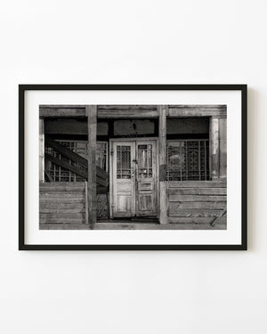 abandoned farmhouse door in rural Romania black and white