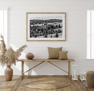 Traditional haystacks scattered across a quiet hillside clearing