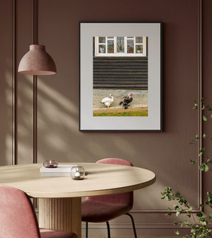 Vertical photograph of a Romanian cottage window and roosters