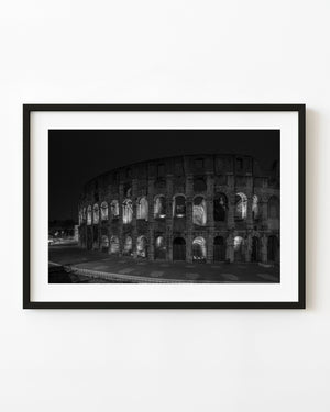 Rome Colosseum illuminated at night in black and white