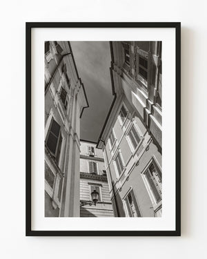Shuttered Roman facades rising around a narrow strip of sky