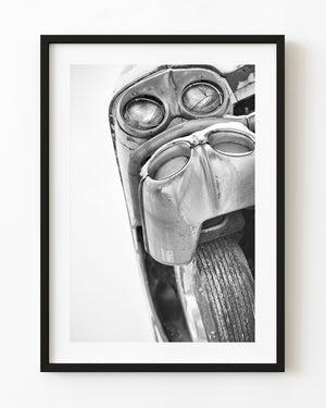 Black and white classic car photographed from directly below
