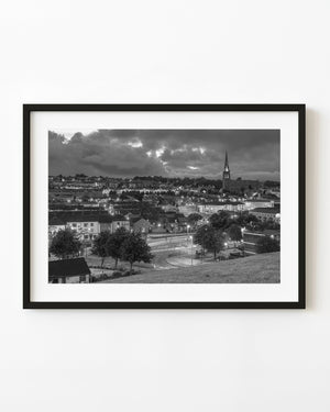 Black and white Rosemount Northern Ireland cityscape beneath heavy clouds