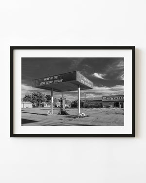 Giant cowboy boot beneath a roadside canopy on Route 66
