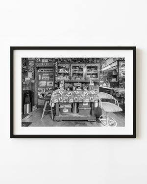 Route 66 shop counter surrounded by signs and vintage memorabilia