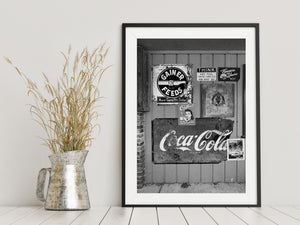 Weathered metal Americana signs mounted on siding