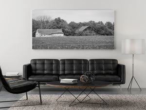 Monochrome Indiana farmland with metal-roofed buildings and crop stubble