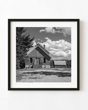 Rural Ontario United Church beneath a sky filled with clouds