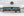 Blue Ontario Barn Beneath a Snow Covered Roof Winter Wall Art
