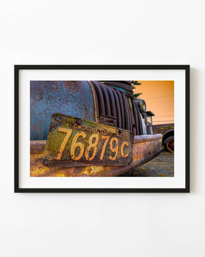 Rusted farm-truck grille with a weathered 1945 Ontario licence plate
